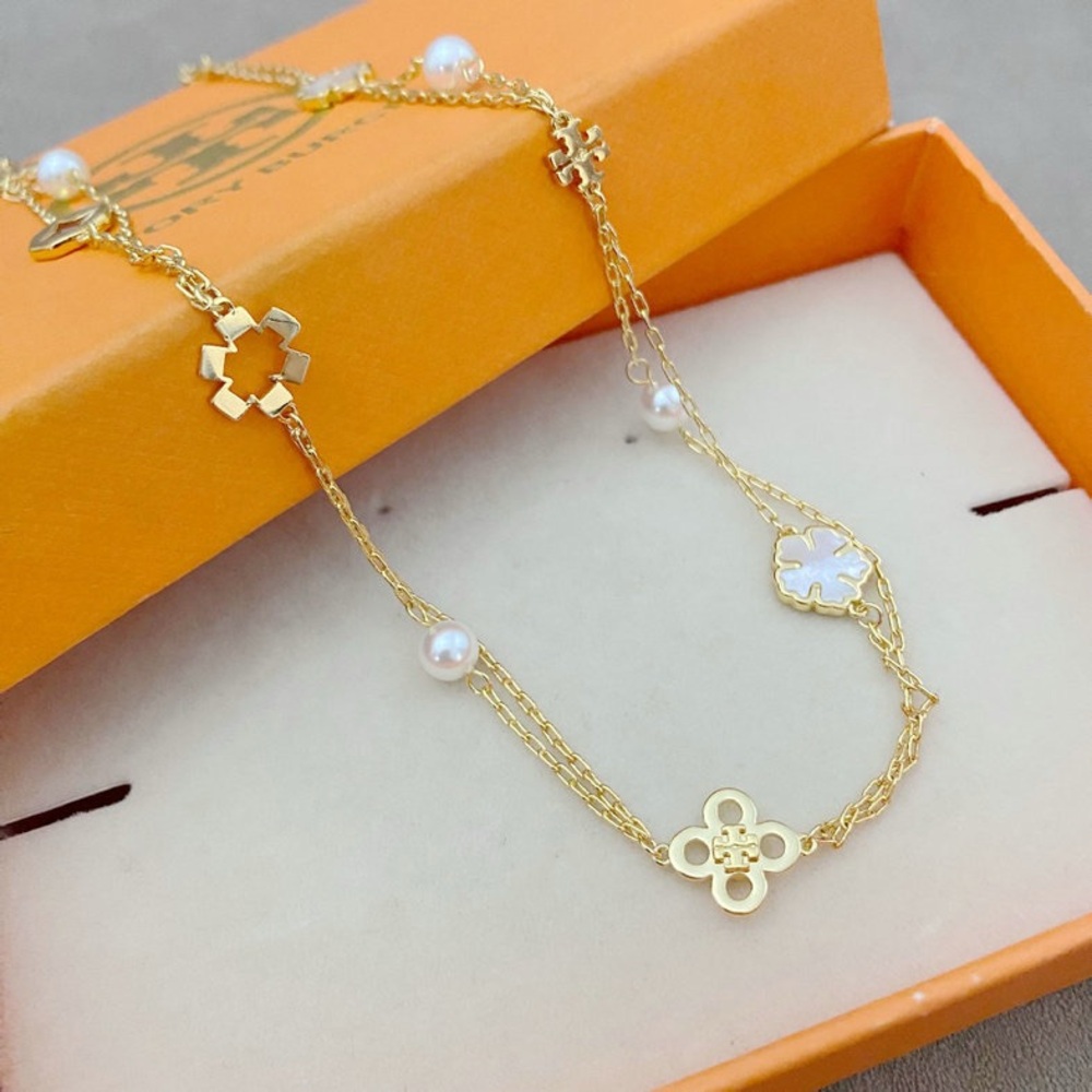 Tory Burch Elegant Gold and Pearl Women's Bracelet